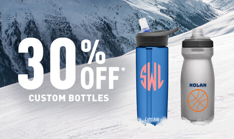 Two customized bottles sitting on a snowy slope Two customized bottles sitting on a snowy slope