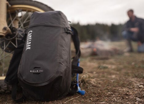 MULE Evo laying down beside a tire MULE Evo laying down beside a tire