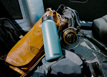 A Fit Cap laying on top of some fishing gear.