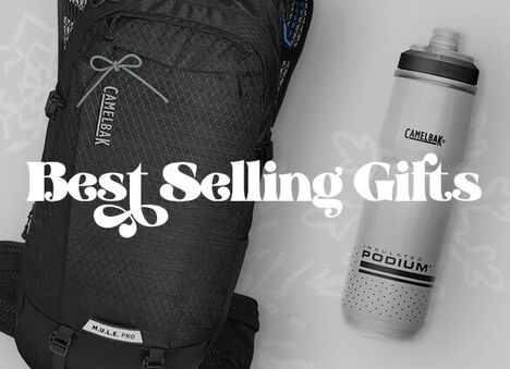 Assorted packs and bottles laying flat on a wrapping paper background with the text "Best Gift Deals" on top.