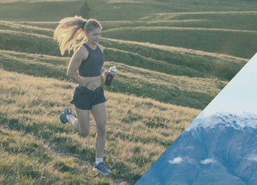 Woman running in a field during sunset