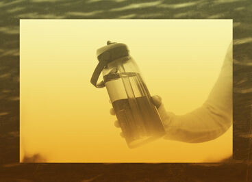 water bottle held up with a yellow fade treatment