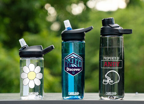 Three custom plastic bottles lined up in a row. Three custom plastic bottles lined up in a row.