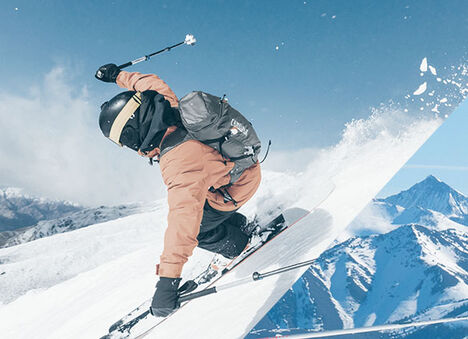Skier flying down a mountain wearing a Snoblast Hydration Pack.
