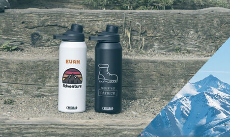 Two insulated stainless steel custom water bottles on wood steps Two insulated stainless steel custom water bottles on wood steps