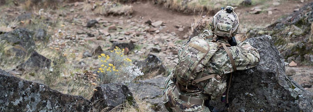 Solider wearing a CamelBak Camouflage Hydration Pack.
