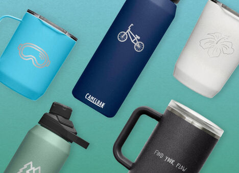 Customized bottles and mugs over a green background