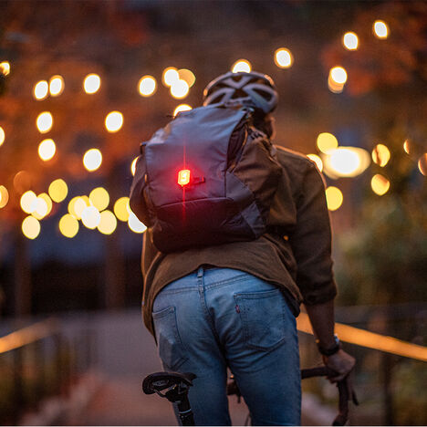 Commuter with a hydration pack on.