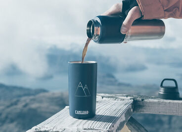 Hot coffee being poured in to a multibev bottle.