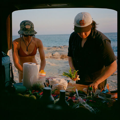 Brian and friend grabbing ingredients out of their car while parked at a beach in Baja