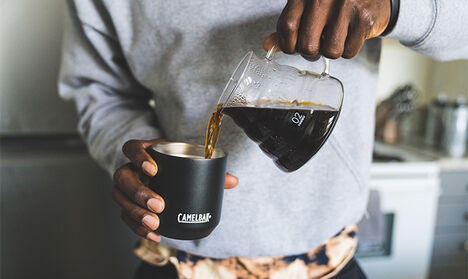 Man pouring coffee in to a Horizon Tumbler