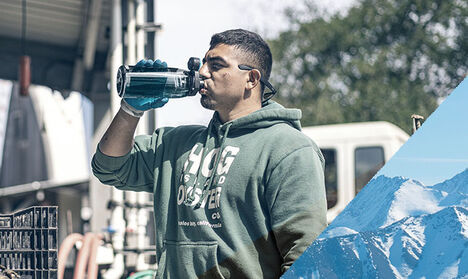Man drinking from a Chute Mag water bottle made with Tritan Renew