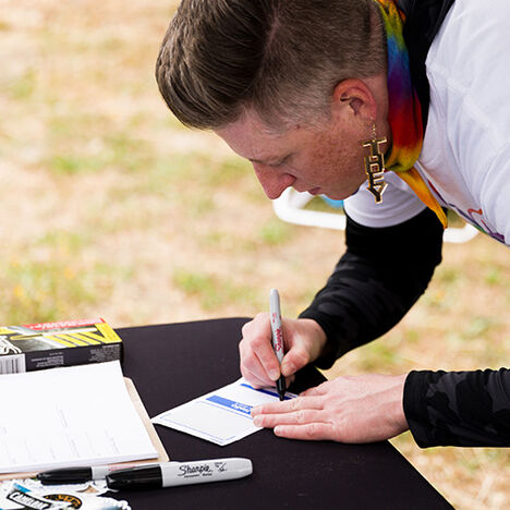 JT signing up to volunteer at an event.