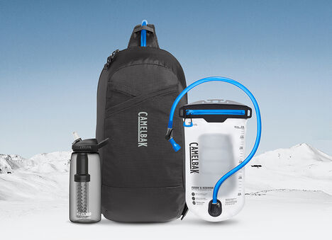 Snowy Mountain Background with Camelbak Pack, Reservoir, and Bottle