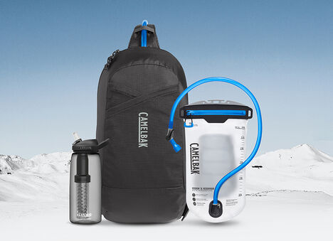 Snowy Mountain Background with Camelbak Pack, Reservoir, and Bottle Snowy Mountain Background with Camelbak Pack, Reservoir, and Bottle