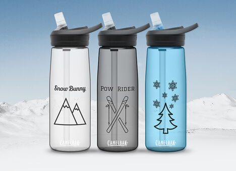 Three Custom Bottles with Unique Holiday Graphics and Snowy Mountain Background
