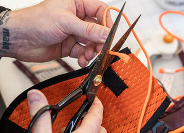 Person crafting a new product by using recycled materials