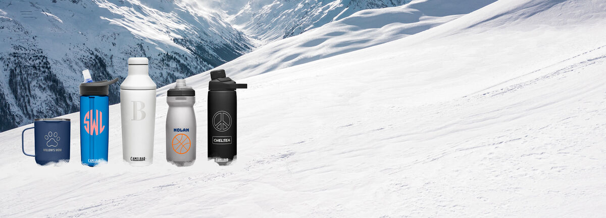 Five custom bottles sitting on a snowy slope. Five custom bottles sitting on a snowy slope.