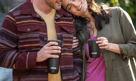 A couple holding two CamelBak Tumblers