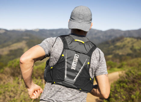 Man running wearing a hydration vest. Man running wearing a hydration vest.