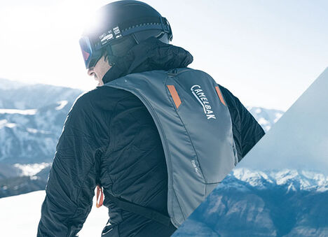 Man with a Zoid hydration pack on. Man with a Zoid hydration pack on.