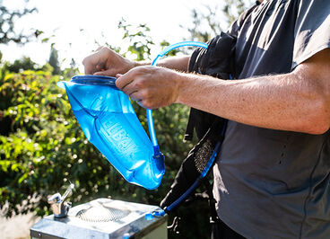 A man sealing up his Crux reservoir for a ride