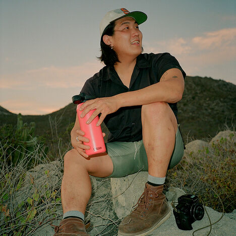 Brian looking off at the Baja scenery while holding a Chute Mag bottle