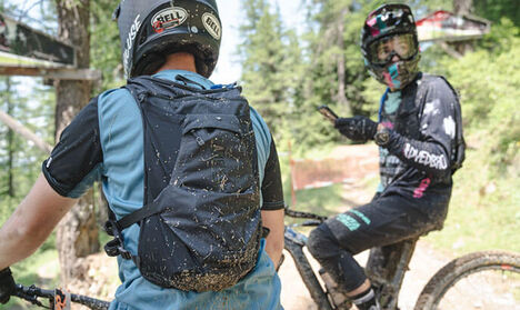 Two mountain bikers stopping on the trail