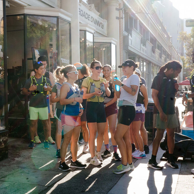 Group of runners outside of a local store