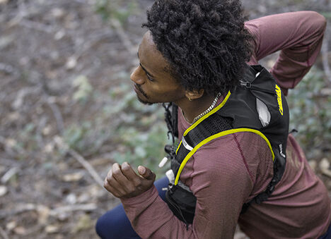 Man running with a Trail Run™ Vest on