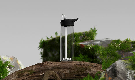 A clear Eddy+ made with Tritan Renew sitting in a natural setting.