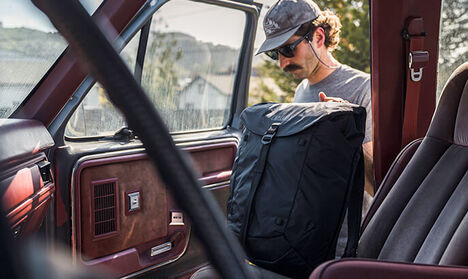 Man loading an ATP 26 Backpack in to his truck
