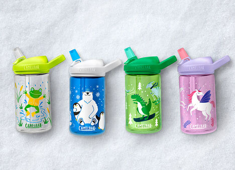 Snowy background with custom kids' bottles lined up on the ground Snowy background with custom kids' bottles lined up on the ground