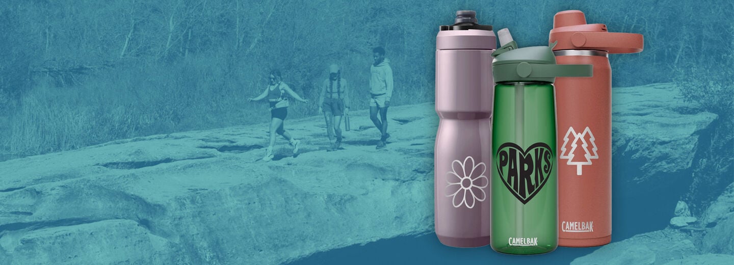 three customized bottles with a person hiking behind