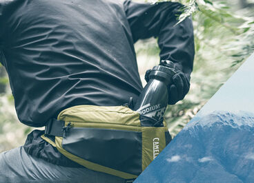 Man pulling a Podium bottle out of the Podium Flow Belt. 