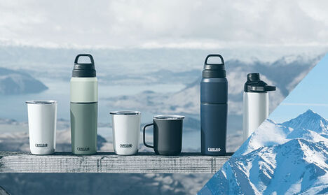 Six Stainless Steel Bottles and Cups with a Mountain Valley Background Six Stainless Steel Bottles and Cups with a Mountain Valley Background