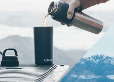 Man filling up his Multibev with an awesome winter view.