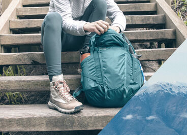 Person reaching into a Helena Hydration Pack.