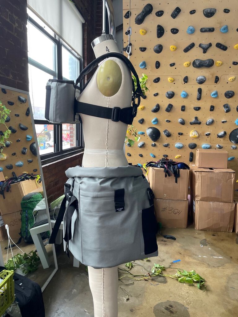 Hydro skirt on a mannequin turned to the left with a climbing wall in the background.