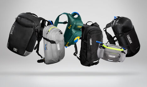 Lineup of the M.U.L.E.® family of bike hydration packs with a gray background.