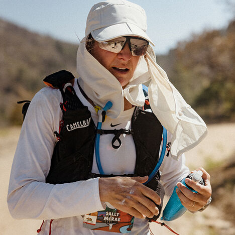 Sally stopping to use her Quick Stow Flask for hydration