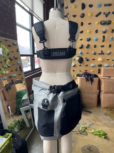 Hydro skirt on a mannequin turned to the back with a climbing wall in the background.