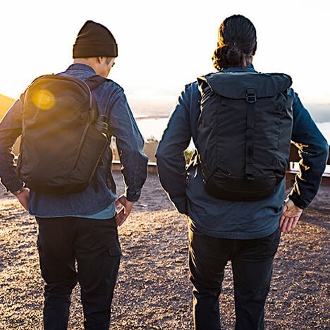 Two guys wearing ATP backpacks, overlooking the Bay Area.