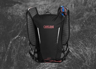 black circuit vest on a bush background