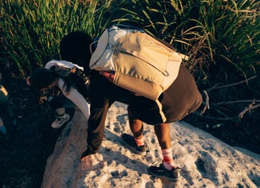 hiker with a tan backpack