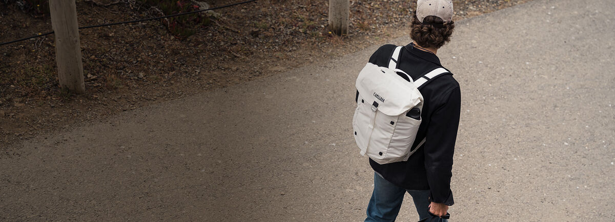 Man walking with an undyed ATP 26 on his back.