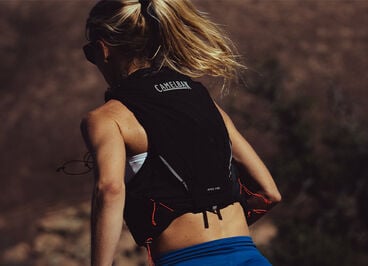 woman running with an Apex vest