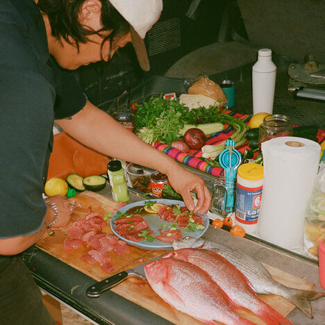 Brian creating a dish with a medley of fresh ingredients.