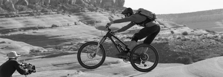 Cameraman films mountain biker Cameraman films mountain biker