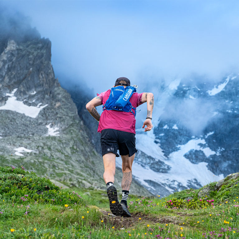 Man running with a Zephyr running vest Man running with a Zephyr running vest